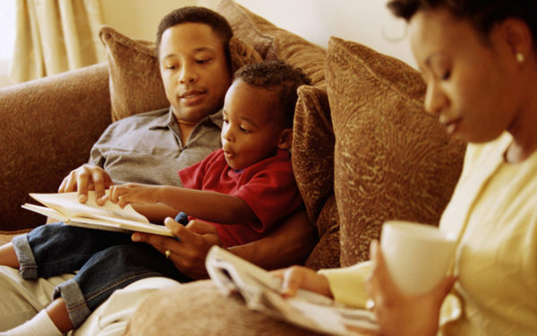 Family reading on the couch