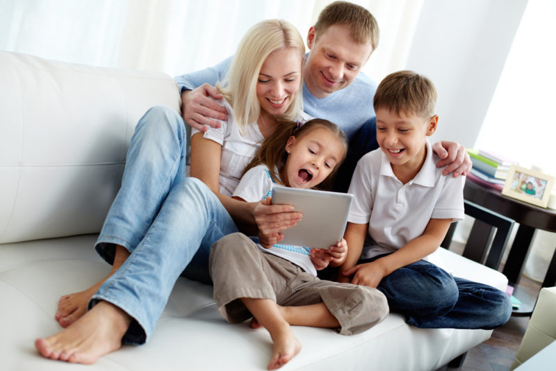 family looking at tablet