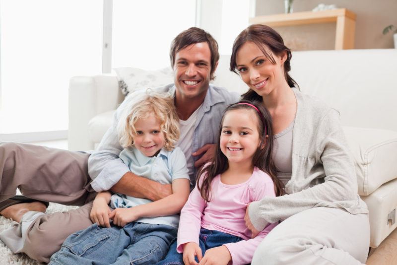 happy family relaxing on couch