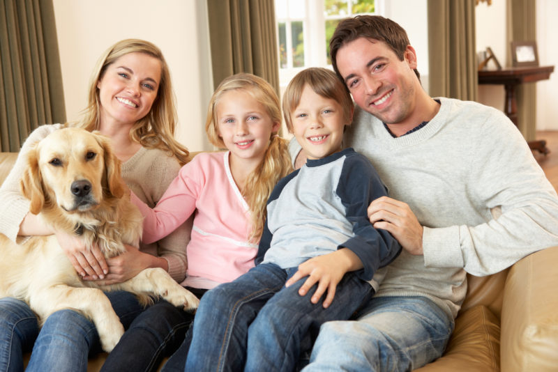 happy family spending time together on couch