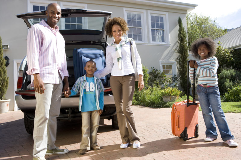 family packing car to leave for vacation